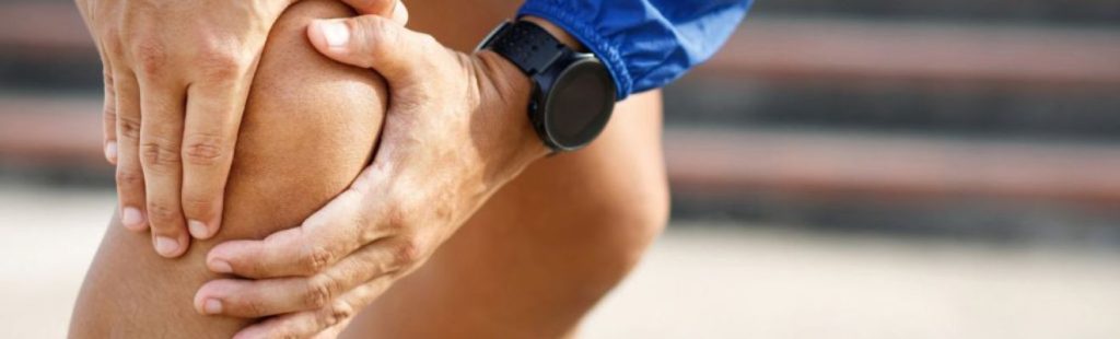 deportista con dolor de rodilla